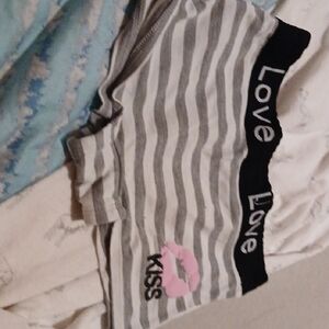 Striped Gray and Black Shorts with Pink Kiss Design